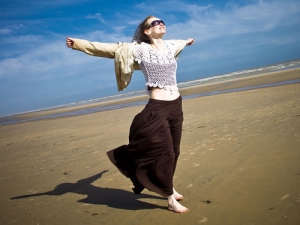 Woman with Open Arms at Beach