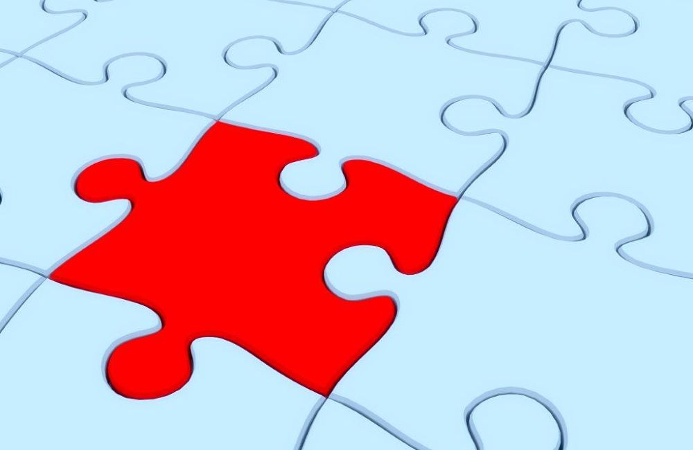 Red Puzzle Piece in Blue Puzzle