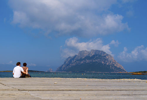 Couple Sitting with Mountain ahead